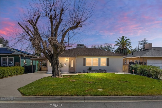 ranch-style house with stucco siding, a yard, concrete driveway, crawl space, and an attached carport