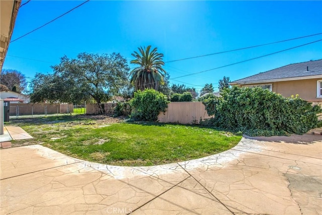 view of yard with a patio and fence