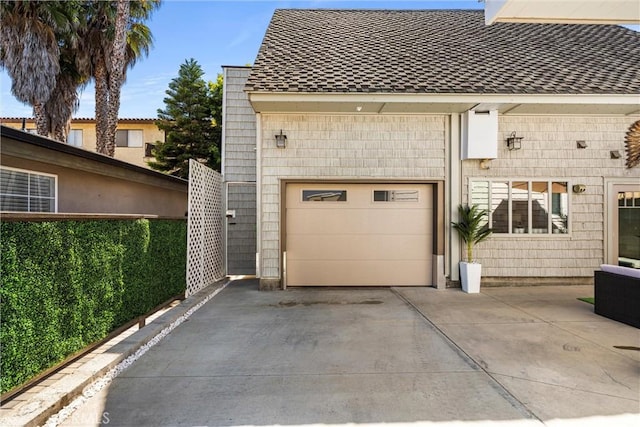 garage with concrete driveway