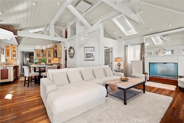 living area featuring dark wood-style floors, beam ceiling, a fireplace, and high vaulted ceiling