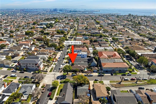 birds eye view of property with a residential view and a water view