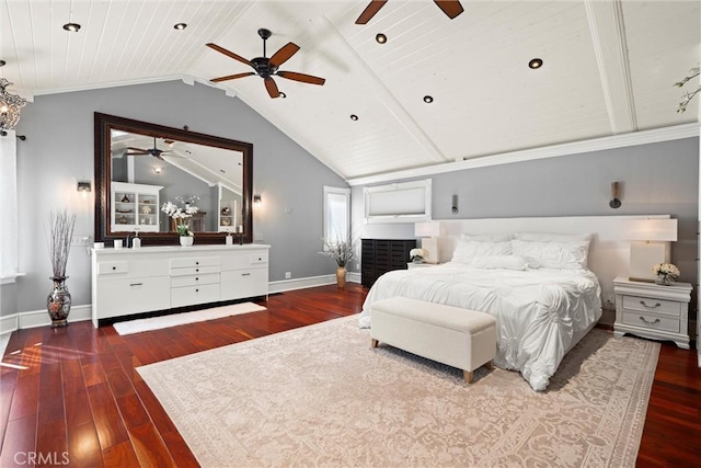 bedroom with baseboards, dark wood finished floors, vaulted ceiling, a ceiling fan, and a sink