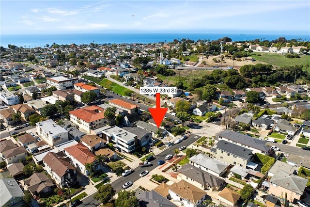birds eye view of property featuring a water view and a residential view