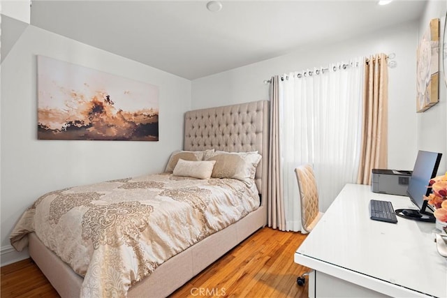 bedroom with light wood-type flooring and recessed lighting