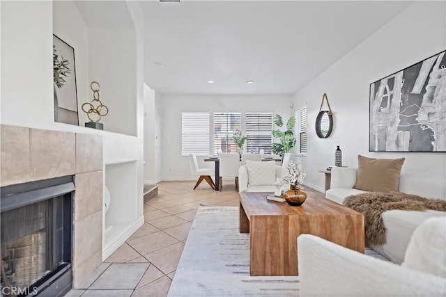 living area with recessed lighting, light tile patterned flooring, a fireplace, and baseboards