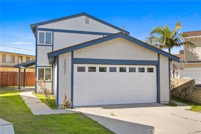 view of front of house featuring a garage, driveway, fence, and stucco siding