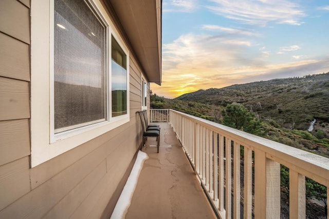 view of balcony at dusk