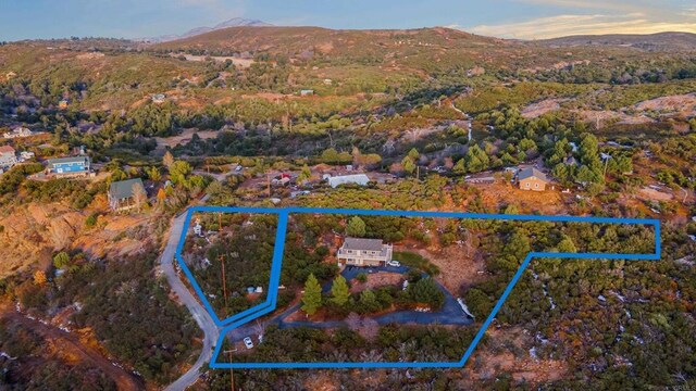 35465 Sunset Ln, Julian, CA 92036 - aerial view of property and surrounding area featuring property parcel outlined and a mountain backdrop