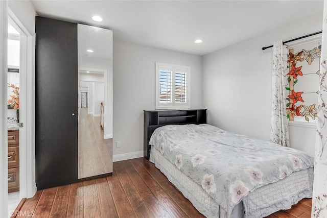 bedroom with recessed lighting, baseboards, and hardwood / wood-style floors