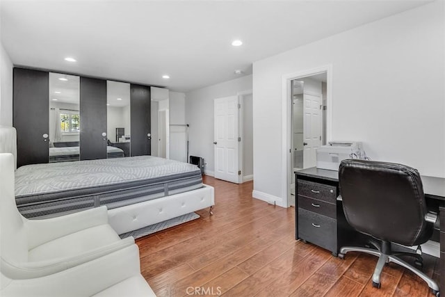 bedroom featuring recessed lighting, baseboards, and wood finished floors