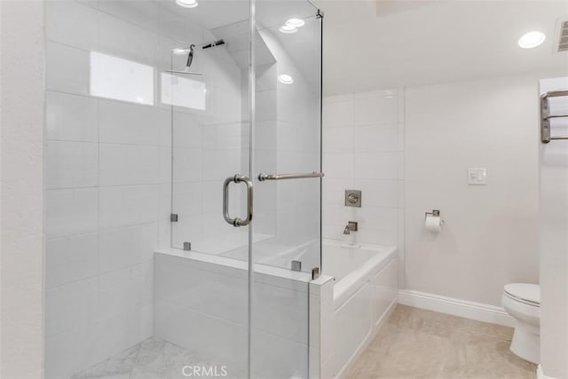 bathroom with a stall shower, baseboards, visible vents, toilet, and a garden tub