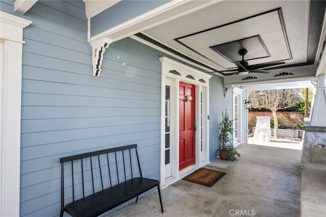 doorway to property featuring a ceiling fan and covered porch