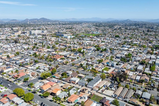 drone / aerial view featuring a residential view and a mountain view