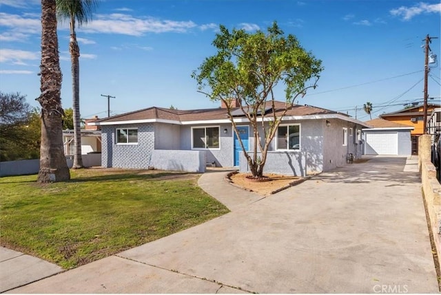 ranch-style house with an outbuilding, a detached garage, fence, stucco siding, and a front lawn