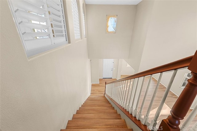 staircase with wood finished floors