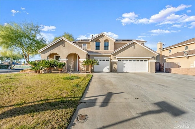 view of front of home featuring solar panels, concrete driveway, stucco siding, fence, and a front yard