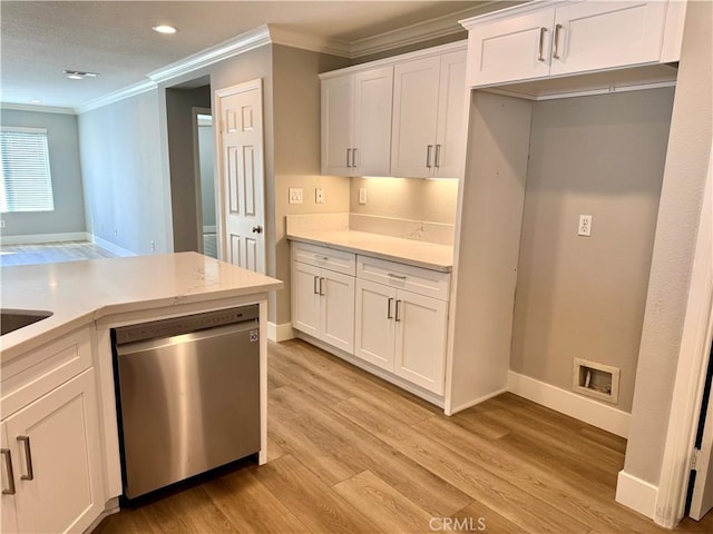 kitchen featuring baseboards, white cabinets, dishwasher, light wood-style flooring, and crown molding