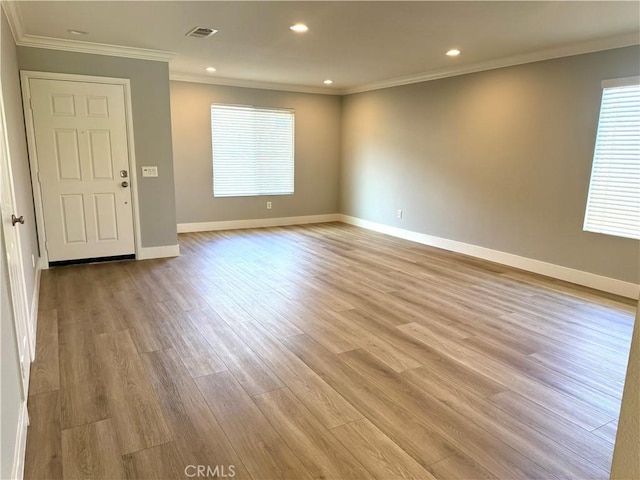 unfurnished room featuring baseboards, ornamental molding, recessed lighting, and light wood-style floors