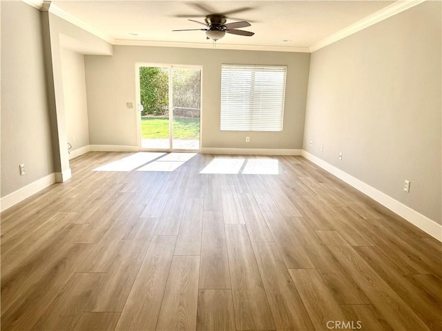 unfurnished room featuring light wood finished floors, baseboards, and ornamental molding