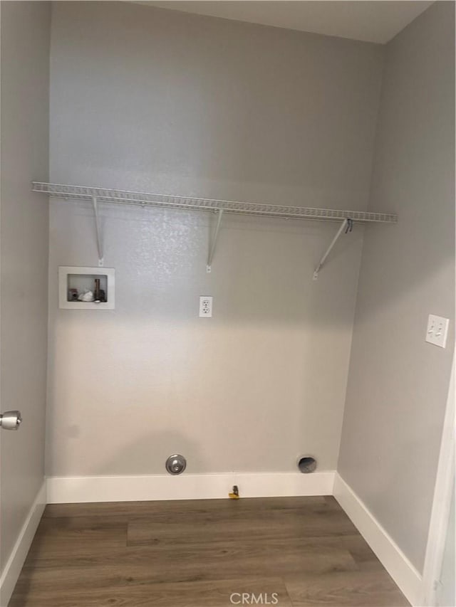 laundry room with hookup for a washing machine, laundry area, baseboards, and dark wood-style flooring