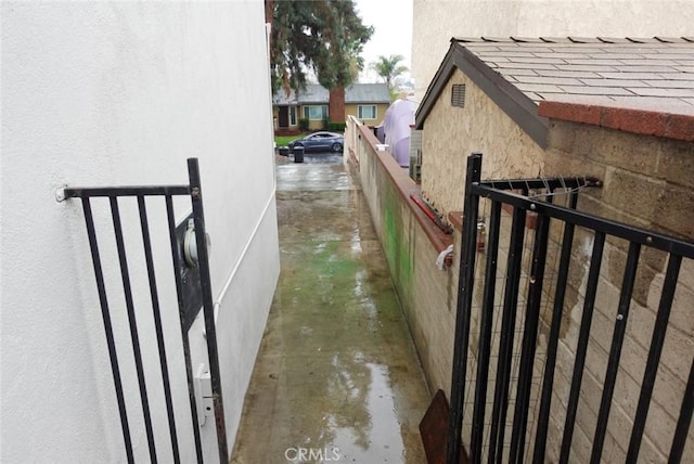 view of property exterior featuring fence and stucco siding