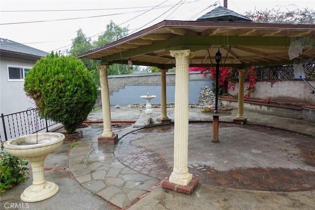 view of patio / terrace featuring fence