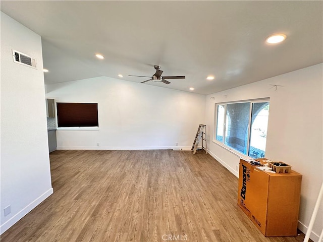 unfurnished living room featuring recessed lighting, wood finished floors, visible vents, and baseboards