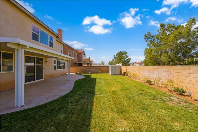 view of yard featuring a patio area and a fenced backyard