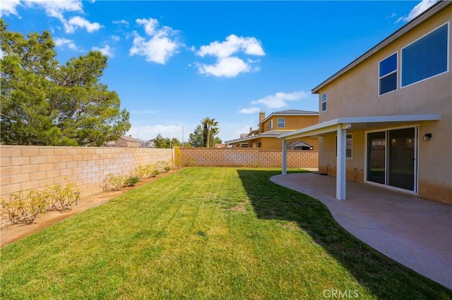 view of yard with a fenced backyard and a patio