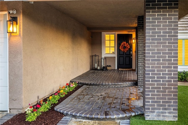 doorway to property with stucco siding