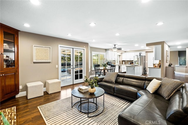 living area featuring baseboards, a ceiling fan, dark wood-type flooring, french doors, and recessed lighting
