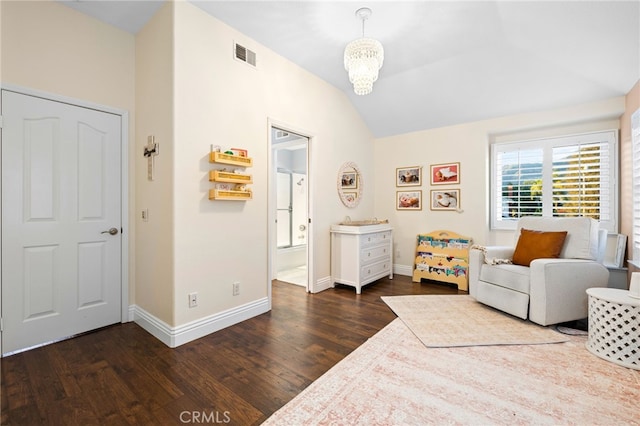 sitting room with lofted ceiling, a notable chandelier, dark wood-style flooring, visible vents, and baseboards