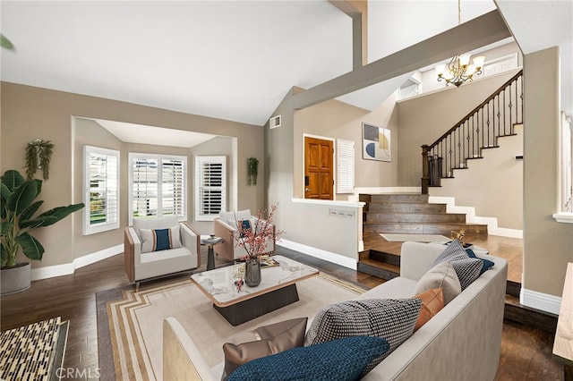 living room featuring a chandelier, stairway, baseboards, and wood finished floors