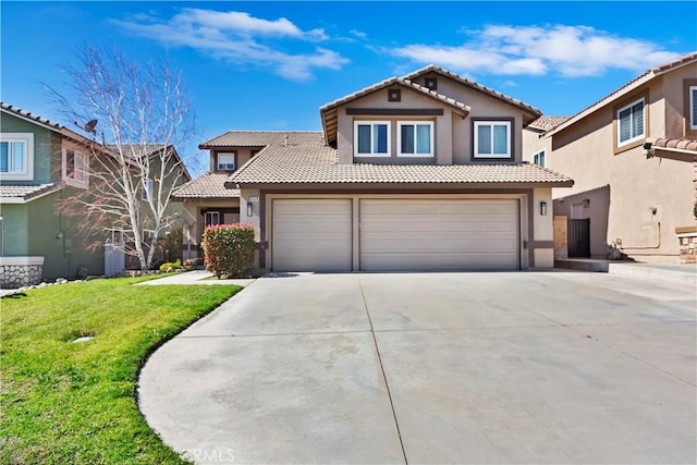 mediterranean / spanish house with driveway, a front yard, a tile roof, and stucco siding