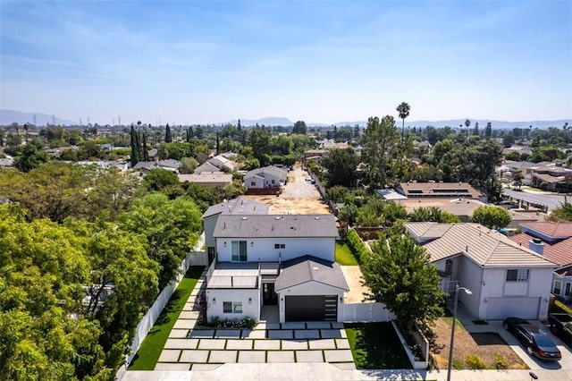 drone / aerial view with a residential view and a mountain view