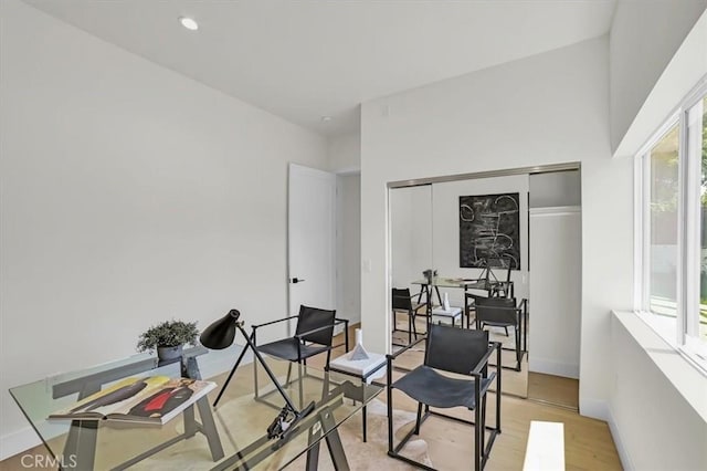 office space featuring recessed lighting, light wood-type flooring, and baseboards