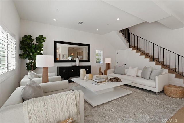 living room with recessed lighting, visible vents, and stairway