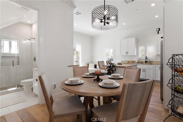 dining room with visible vents, recessed lighting, plenty of natural light, and a chandelier