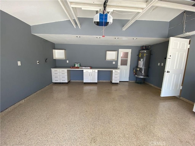 garage with water heater and a garage door opener