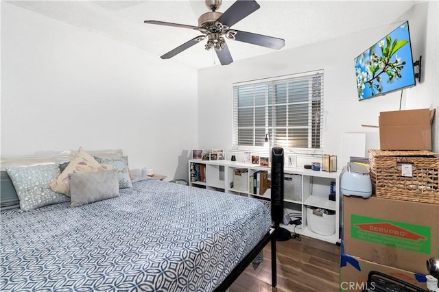 bedroom with a ceiling fan and wood finished floors