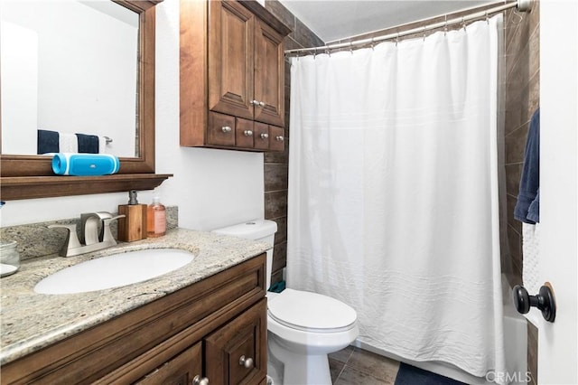 bathroom with tile patterned floors, a shower with shower curtain, toilet, and vanity