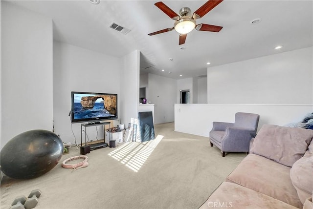 carpeted living area with visible vents, a ceiling fan, and recessed lighting