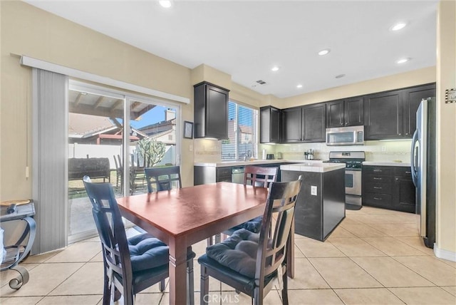 dining area featuring recessed lighting, visible vents, and light tile patterned floors