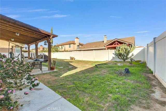 view of yard featuring a patio area and a fenced backyard