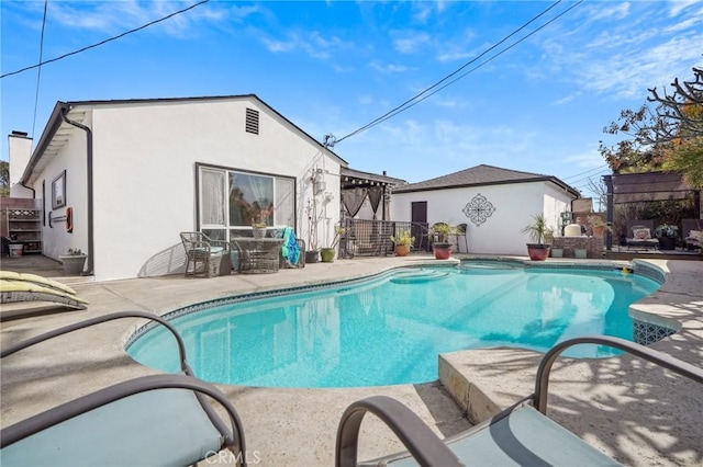 view of swimming pool with a patio area and a fenced in pool