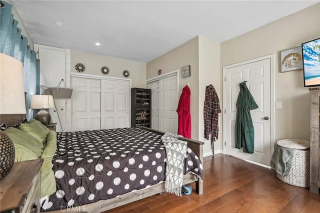 bedroom featuring a closet, baseboards, and wood finished floors