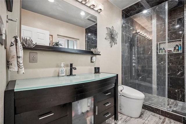 full bathroom featuring vanity, toilet, and a stall shower