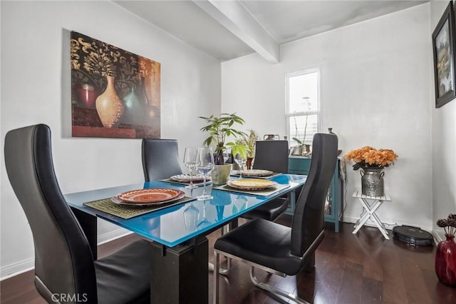 dining space with beamed ceiling, wood finished floors, and baseboards