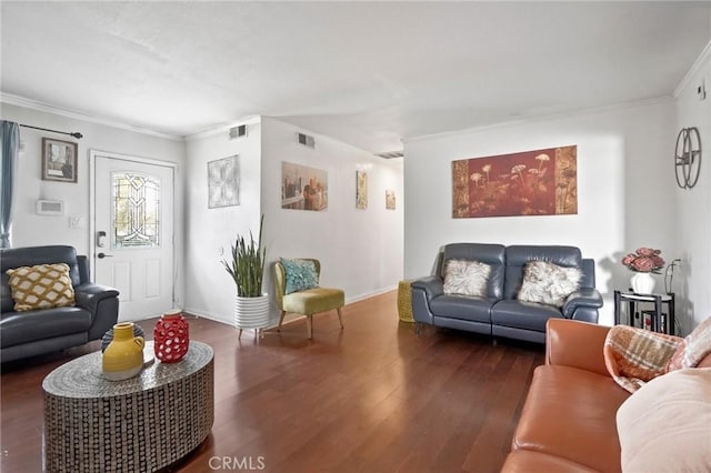 living area featuring visible vents, wood finished floors, and ornamental molding