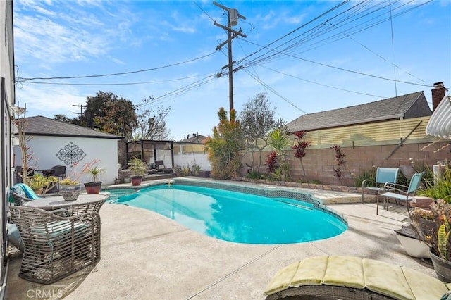 view of swimming pool with a fenced backyard, a fenced in pool, and a patio